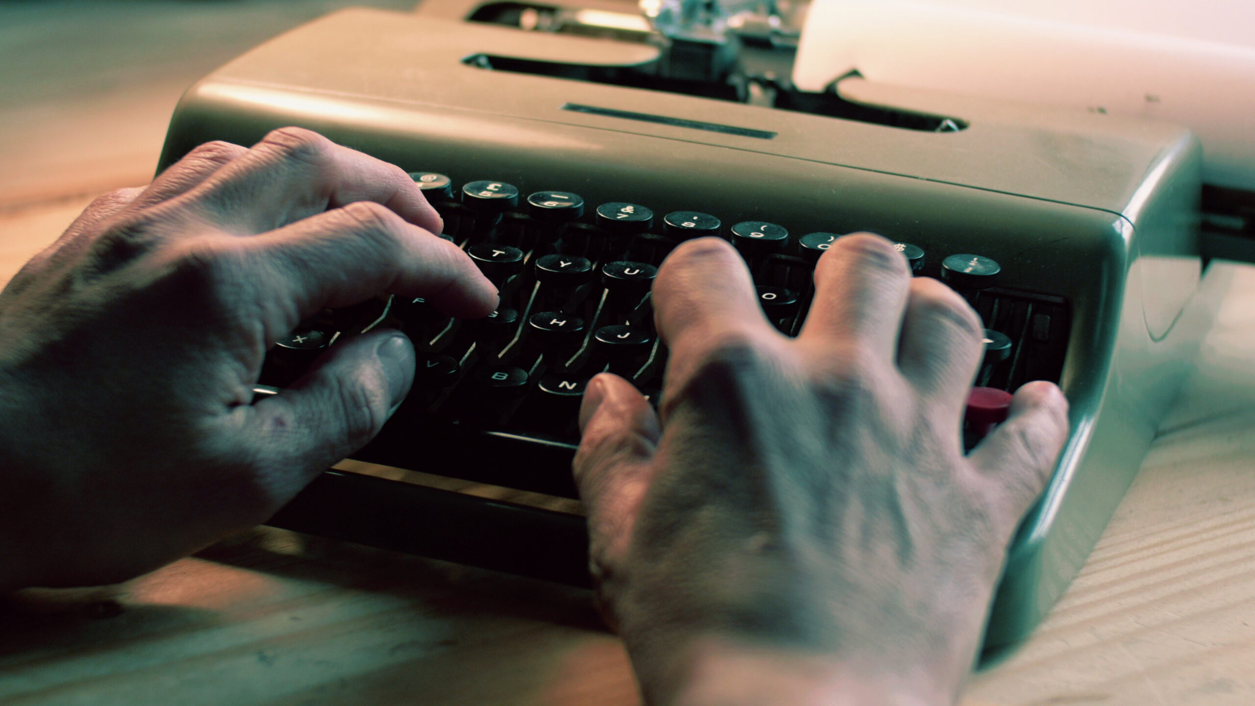 Writer working on typewriter finding time to write during busy schedule